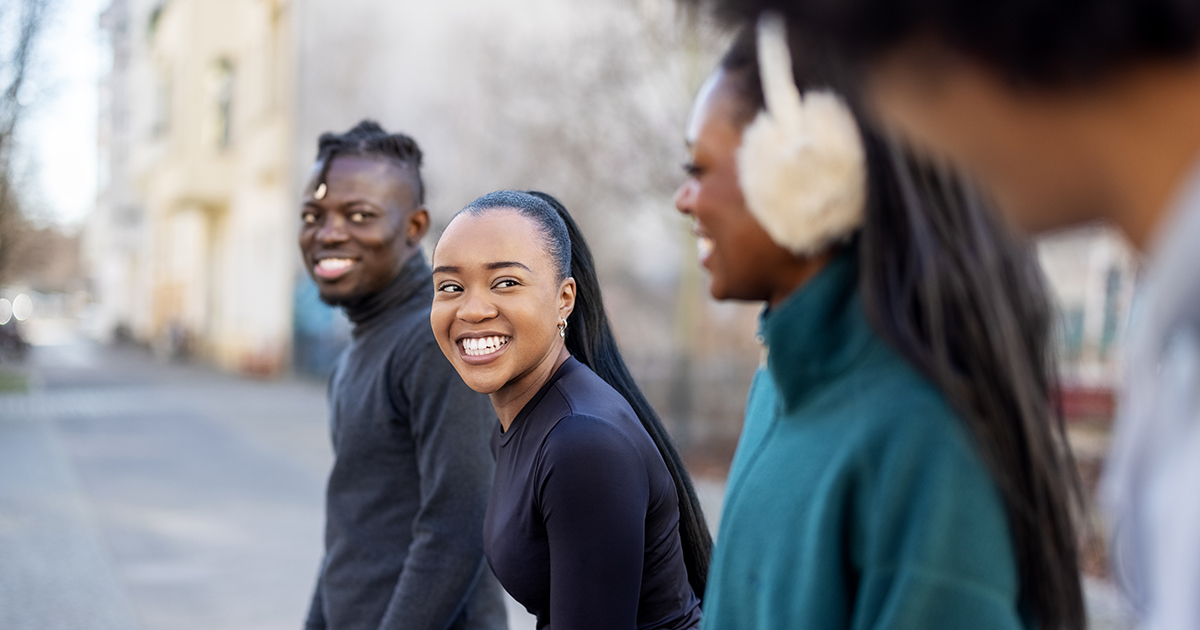 Young adults walking down the street