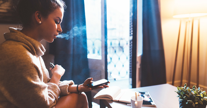Girl vaping and texting