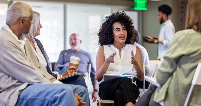 Researcher talking to a group